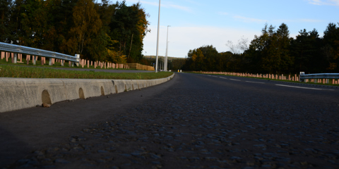 Close up view of Marshalls Mini Beany running alongside a main road