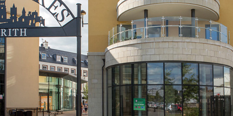 Cast stone details including arches, window surrounds, corbels, gables and band courses