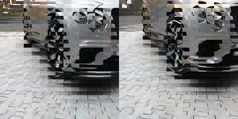 Marshalls Sawn Granite setts in light laid on a driveway with a silver car parked over the top