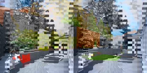 Marshalls Arrento silver laid in a garden with a small seating area