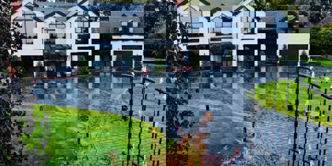 Marshalls Drivesys Riven paving laid on the driveway of a modern white house 