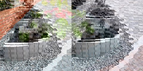 Marshalls Driveline Nova laid around a modern planter full of green shrubs