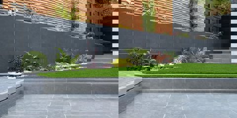 Marshalls Arrento silver paving laid next to grass 