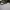 Sawn Granite setts with white car parked on driveway