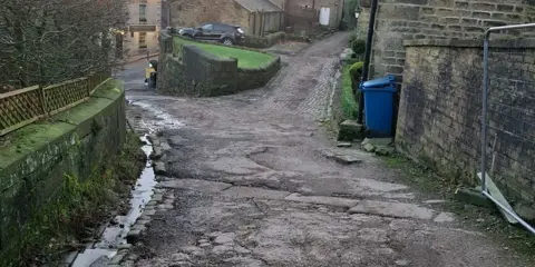 An uneven sloped road
